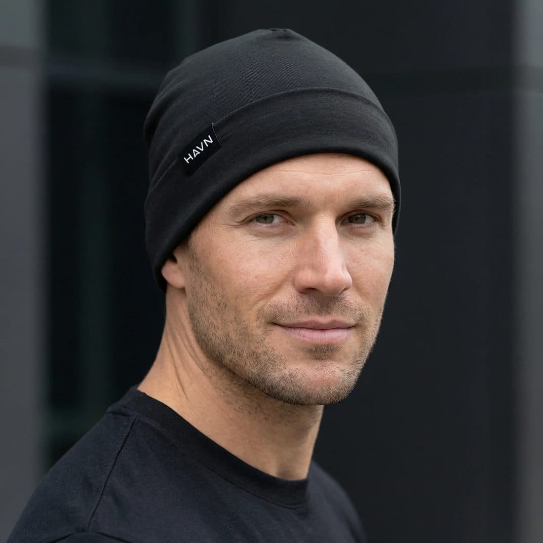 A man wearing the black HAVN WaveStopper beanie.